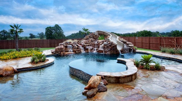 Natural swimming pool with kids water feature - Master Pools Guild